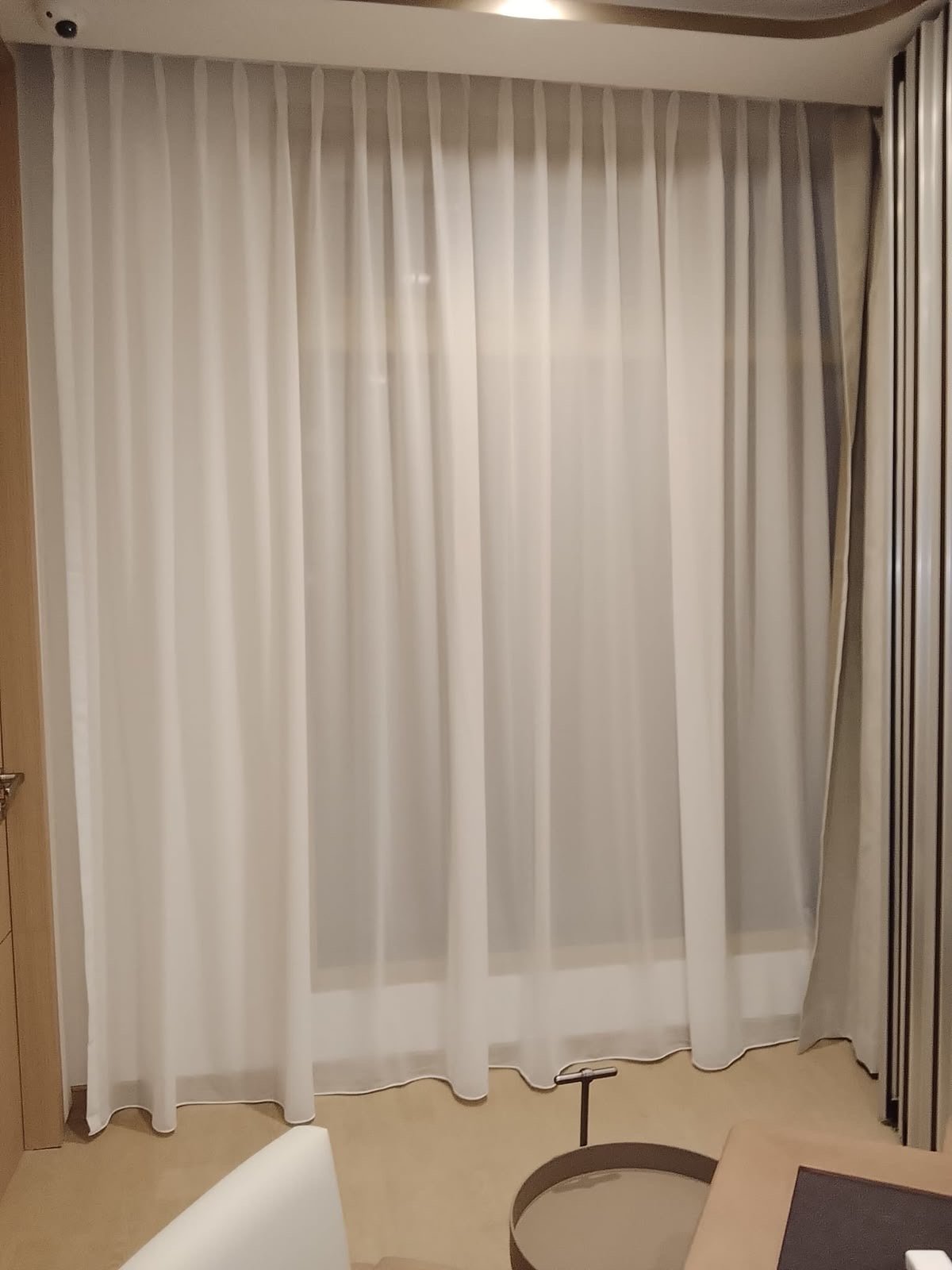 Sheer curtain beside glazed doors