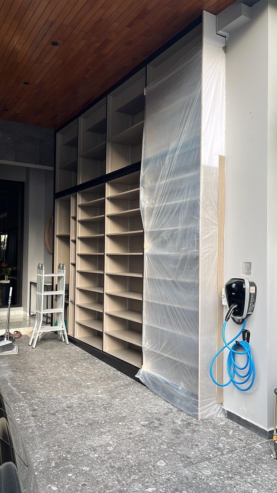 Wall-mounted EV charger and built-in cabinet